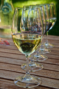 Close-up of wine glasses on table