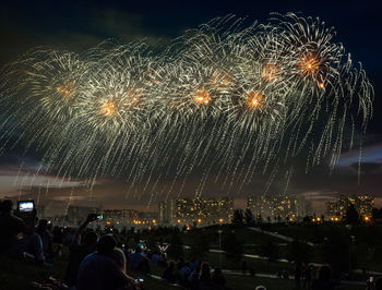 Firework display at night