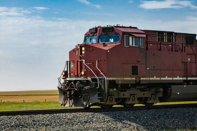 Train on railroad track against sky