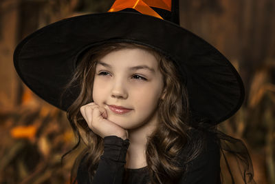 Portrait of young woman wearing hat