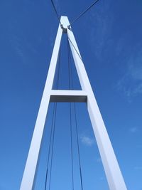 Low angle view of bridge against clear blue sky