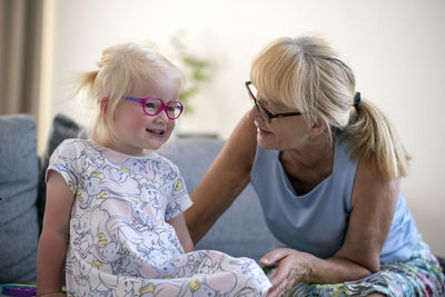 Grandmother  and granddaughter at home