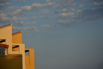 Low angle view of sea against sky during sunset