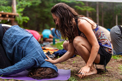 Rear view of women sitting outdoors