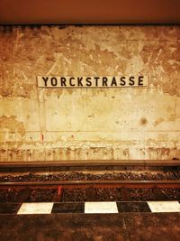 Close-up of text on railroad station platform