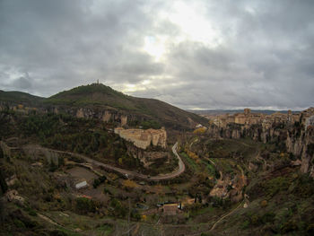 Aerial view of mountain against cloudy sky