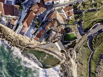 High angle view of river amidst buildings