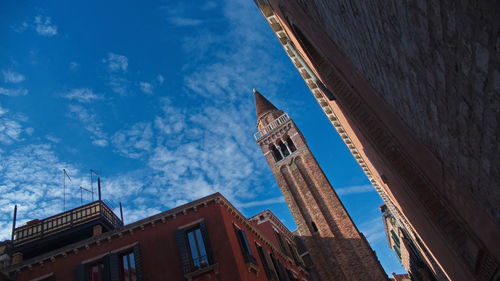 Low angle view of buildings against blue sky