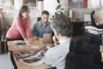 Business colleagues working at desk in office