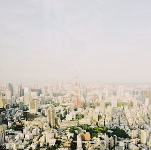 Aerial view of cityscape against sky