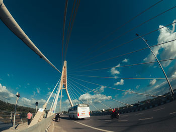 Vehicles on road against sky