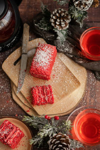 Strawberry piece of cake and red fruit tea, with winter decorations