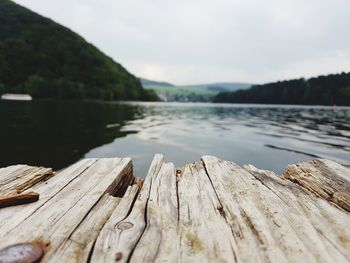 Pier over lake against clear sky