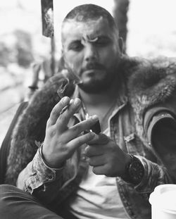 Close-up of man smoking cigarette