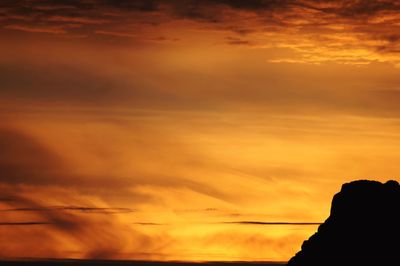 Low angle view of dramatic sky during sunset