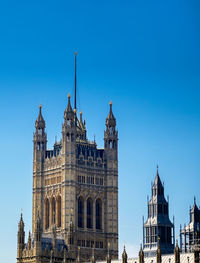 Low angle view of building against blue sky