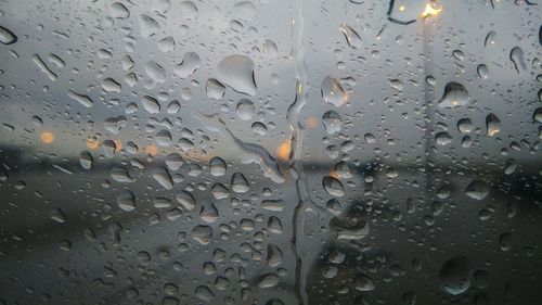 Full frame shot of raindrops on glass window