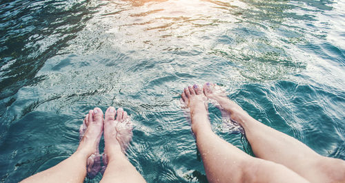 Low section of woman in swimming pool