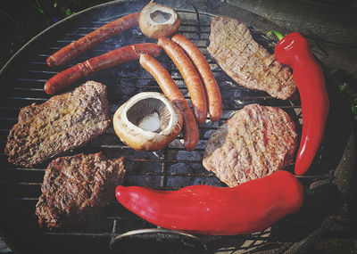 High angle view of meat on barbecue