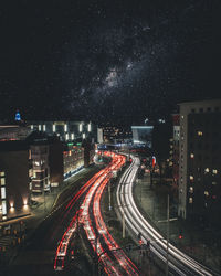 High angle view of light trails on road at night