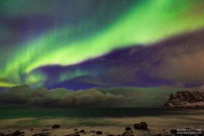 Scenic view of sea against sky at night