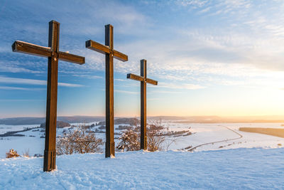 Scenic view of field against sky during winter