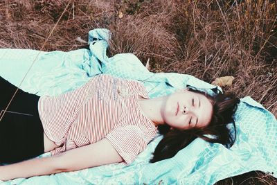 Girl relaxing on grass in park