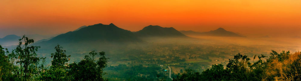 Scenic view of landscape against sky during sunset