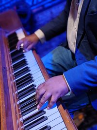 High angle view of man playing piano