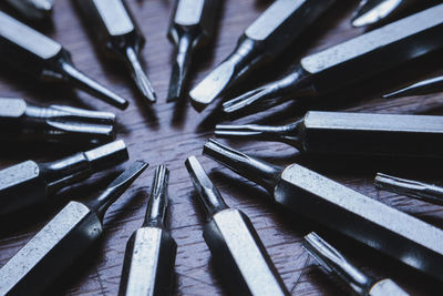 Close-up of drill bits on table