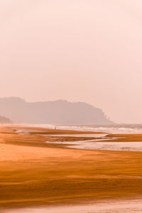 Scenic view of ocean against sky during sunset