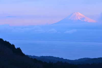 Scenic view of lake and mt fuji against sky during sunset