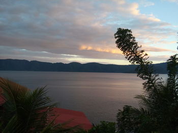 Scenic view of lake against sky during sunset