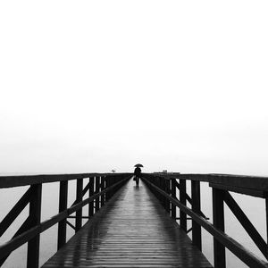 Pier on sea against sky