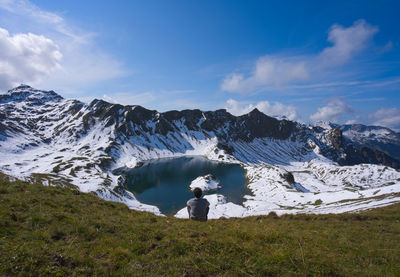 Scenic view of snowcapped mountains against sky
