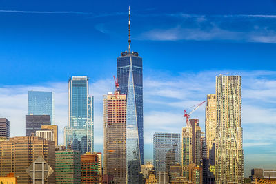 Skyscrapers in city against sky