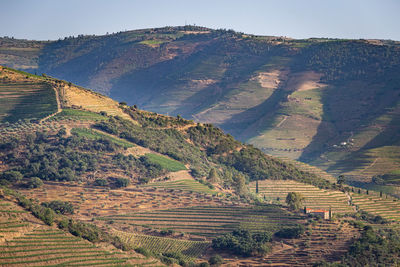 High angle view of land and mountains against sky