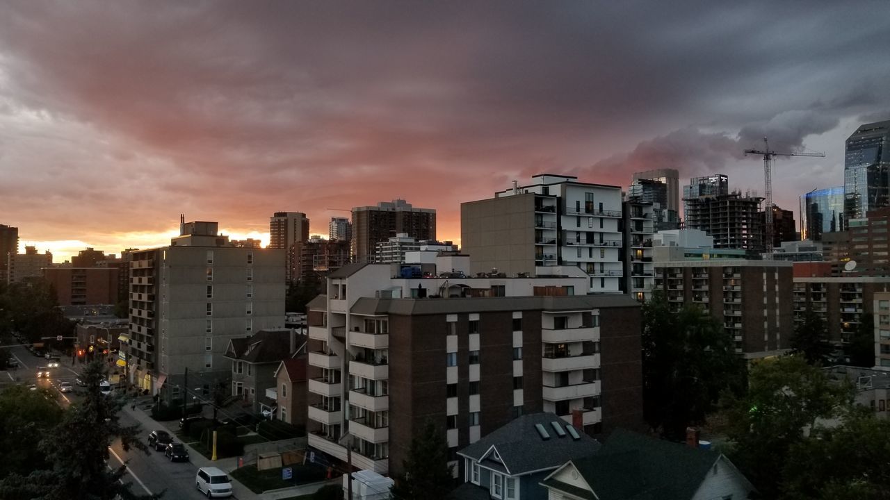 building exterior, architecture, built structure, city, building, sky, cloud - sky, cityscape, residential district, no people, nature, high angle view, sunset, outdoors, office building exterior, skyscraper, tall - high, apartment