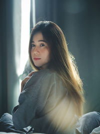 Portrait of young woman looking away