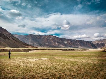 Scenic view of landscape and mountains against sky