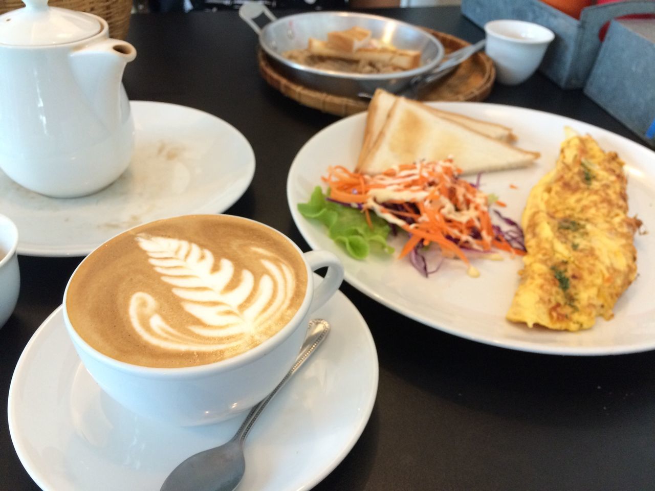 food and drink, indoors, freshness, table, plate, coffee cup, food, still life, saucer, drink, refreshment, ready-to-eat, coffee - drink, spoon, high angle view, serving size, healthy eating, close-up, indulgence, breakfast