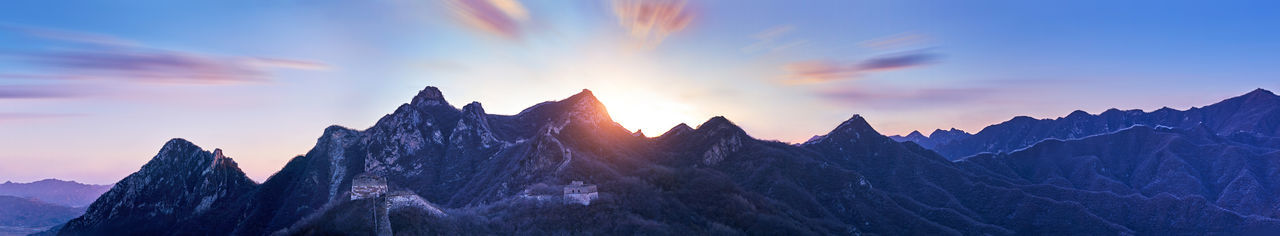 Panoramic view of mountains against sky during sunset