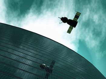 Low angle view of building against cloudy sky