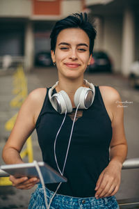 Portrait of smiling woman standing outdoors