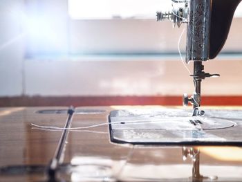Close-up of machine part on table