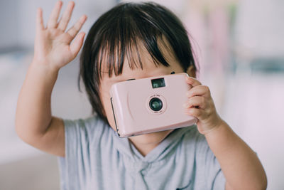 Portrait of woman photographing