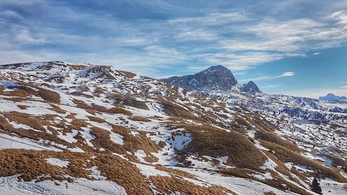 Low angle view of snow covered mountain against sky