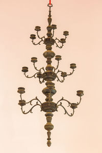 Low angle view of illuminated lamp against sky