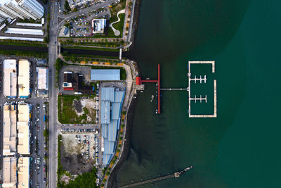 Directly above shot of illuminated commercial dock by city