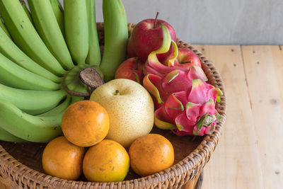 High angle view of fruits in basket on table